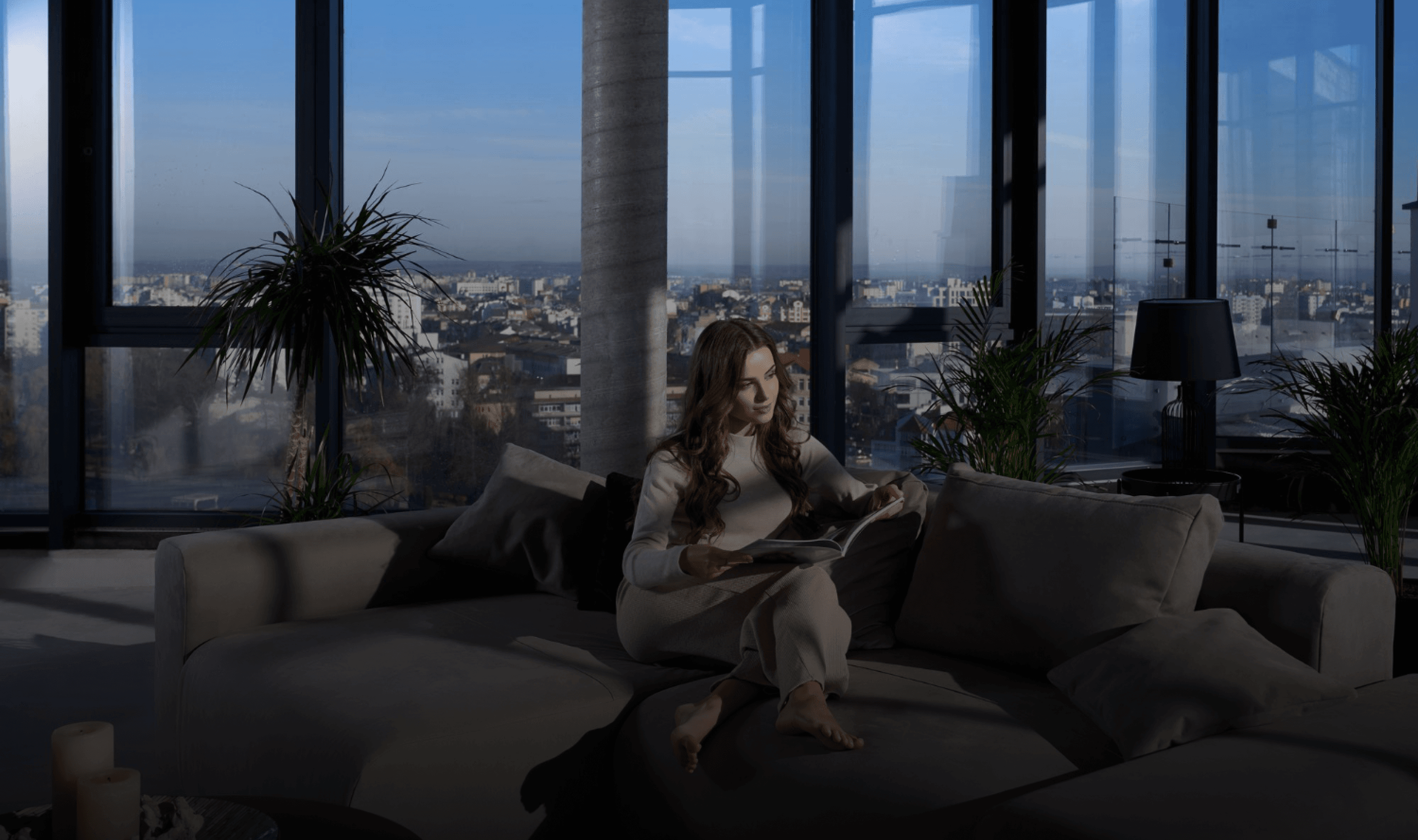 Hands holding holographic city buildings